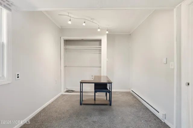 a room that has a window and a table in it