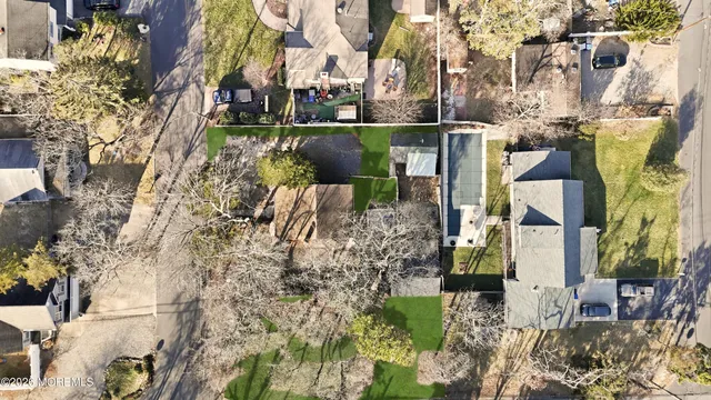 a view of water fountain with large trees