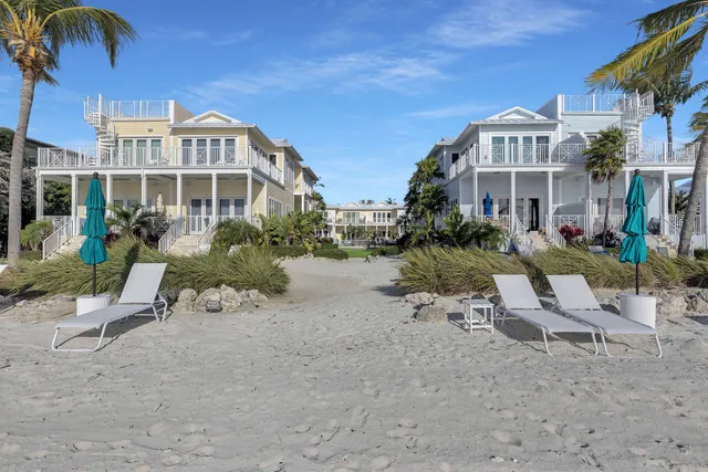 a swimming pool with outdoor seating and yard