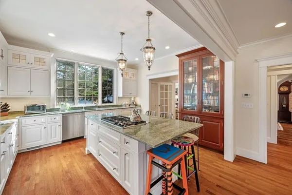 a living room with furniture fireplace and cabinet