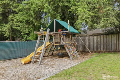 a view of outdoor space with wooden fence