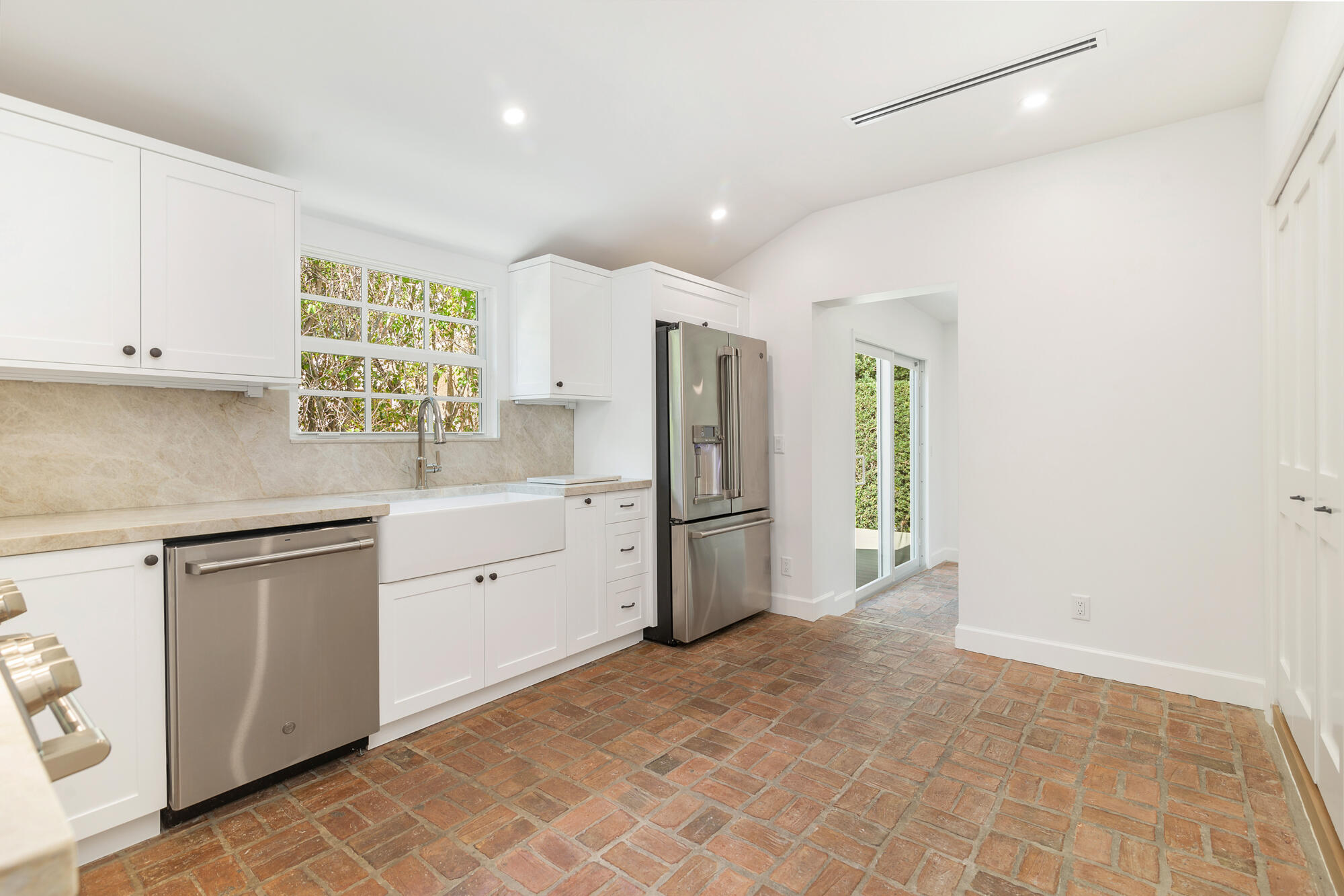222 South County Road Palm Beach, FL 33480 - Photo 11 of 21 a kitchen with white cabinets and white appliances