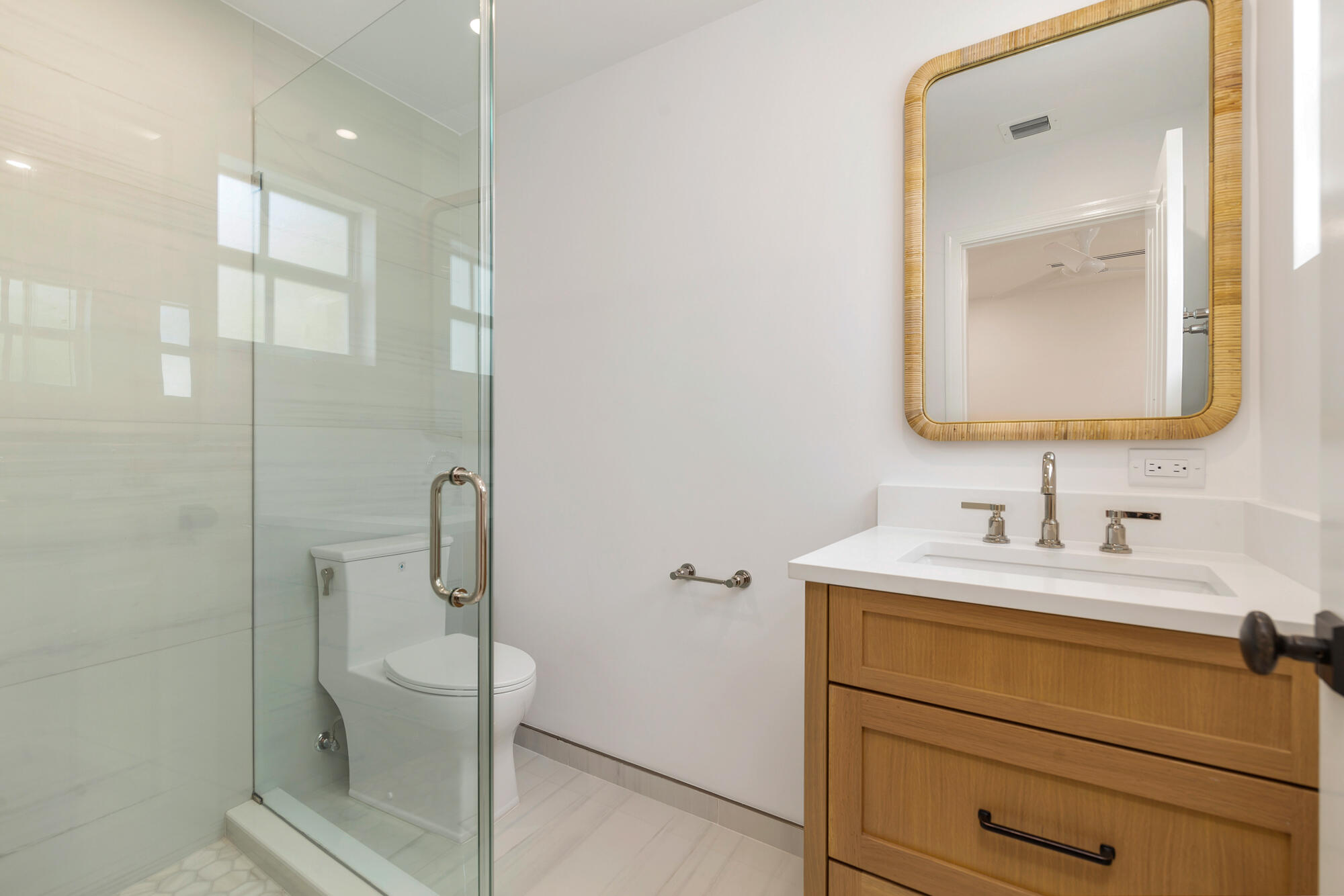 222 South County Road Palm Beach, FL 33480 - Photo 20 of 21 a bathroom with a toilet sink vanity and mirror