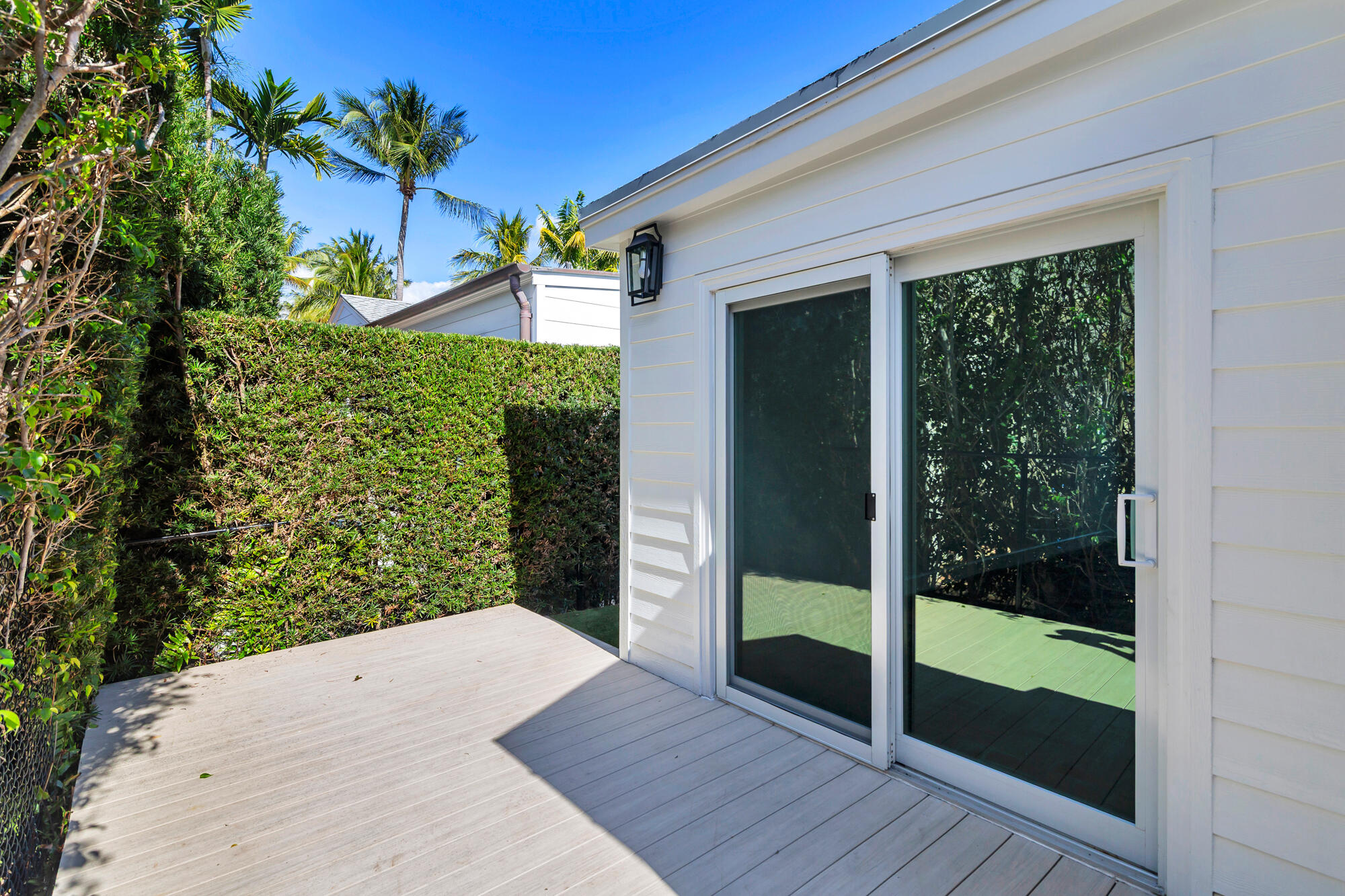 222 South County Road Palm Beach, FL 33480 - Photo 21 of 21 a view of a porch with a floor to ceiling window and wooden floor
