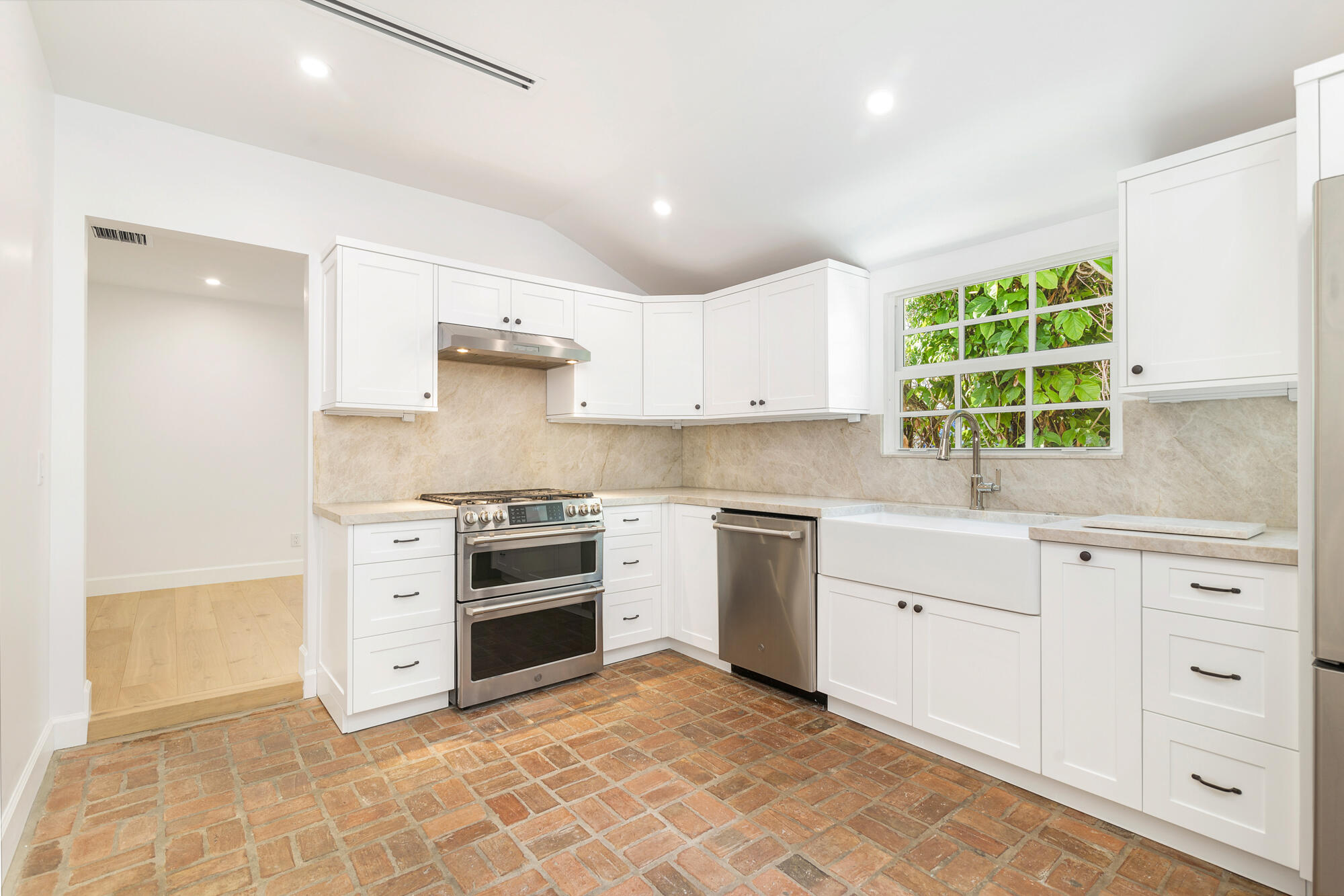 222 South County Road Palm Beach, FL 33480 - Photo 10 of 21 a kitchen with granite countertop a stove a sink and a microwave