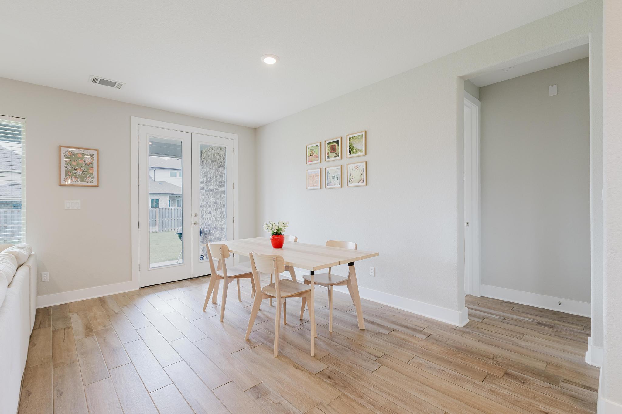 1104 Lickety Lane Georgetown, TX 78633 - Photo 12 of 40 a view of a dining room with hardwood floor and an entryway