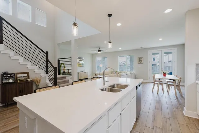 a kitchen with a table chairs and a stove