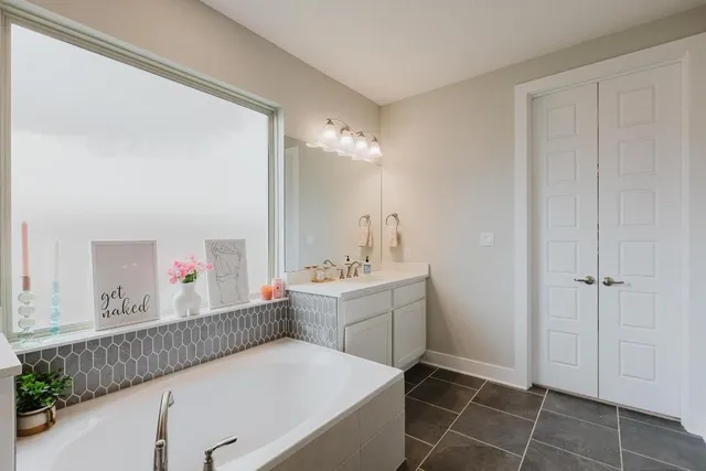 a room with a sink cabinets and utility room