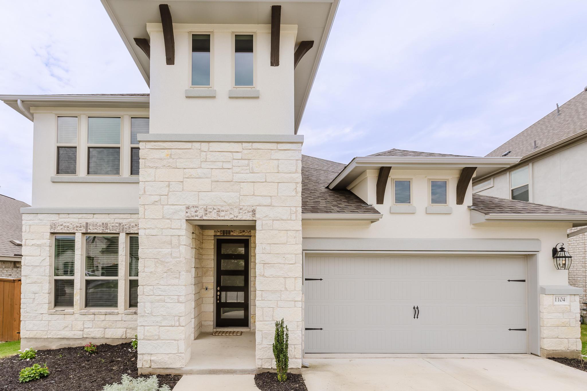 1104 Lickety Lane Georgetown, TX 78633 - Photo 2 of 40 a front view of a house with garage