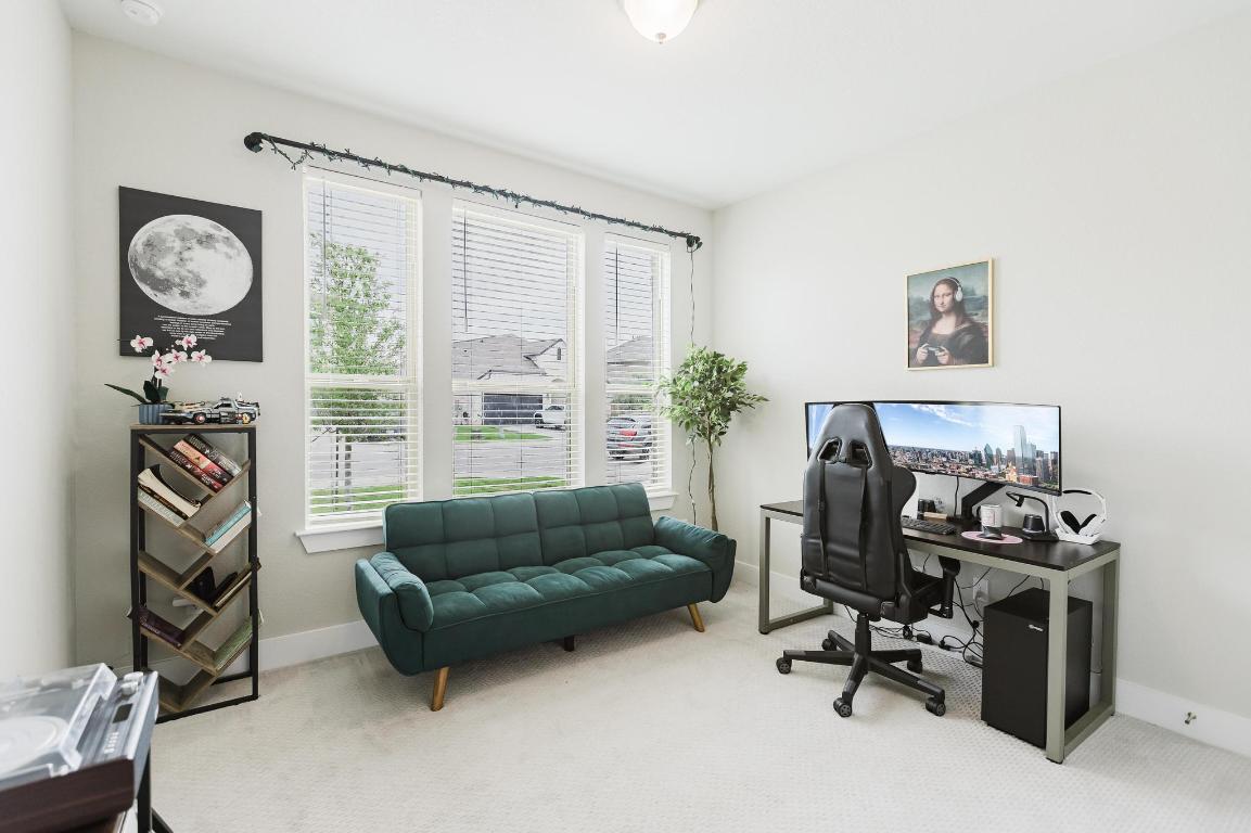 1104 Lickety Lane Georgetown, TX 78633 - Photo 23 of 40 a living room with furniture and a flat screen tv