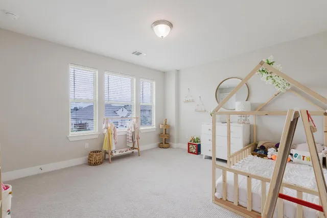 a view of a livingroom with furniture and windows