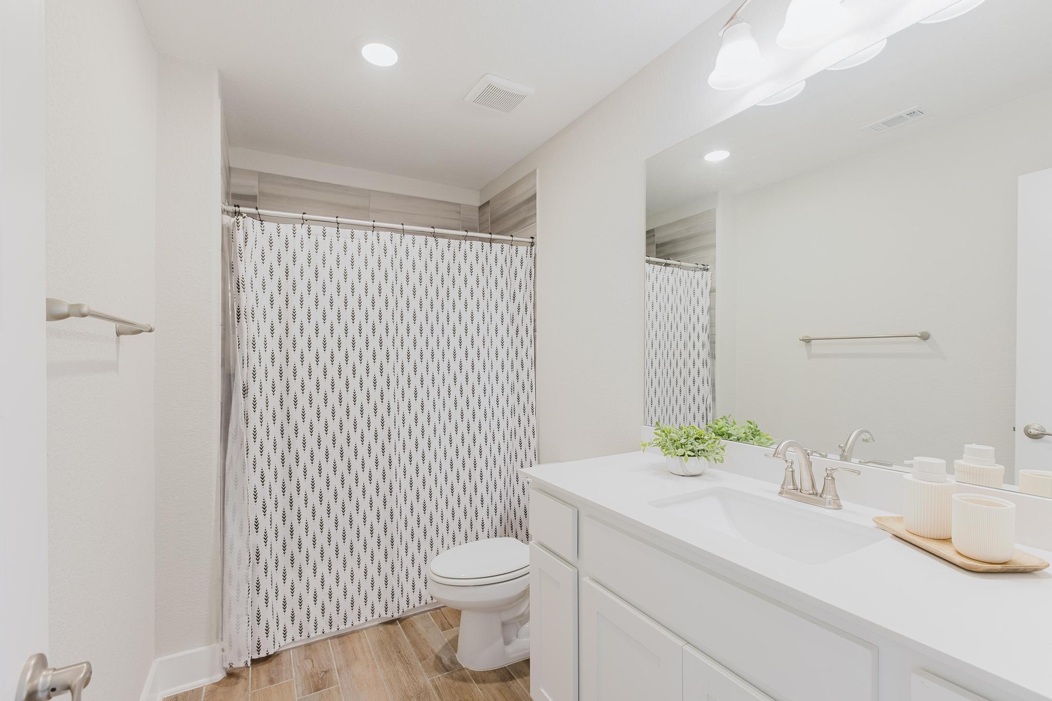 1104 Lickety Lane Georgetown, TX 78633 - Photo 29 of 40 a bathroom with a sink a toilet and shower