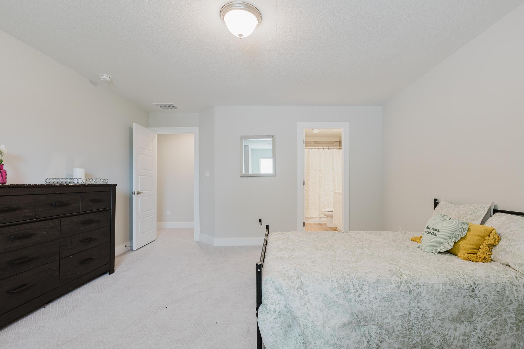1104 Lickety Lane Georgetown, TX 78633 - Photo 32 of 40 a bedroom with a bed and a dresser