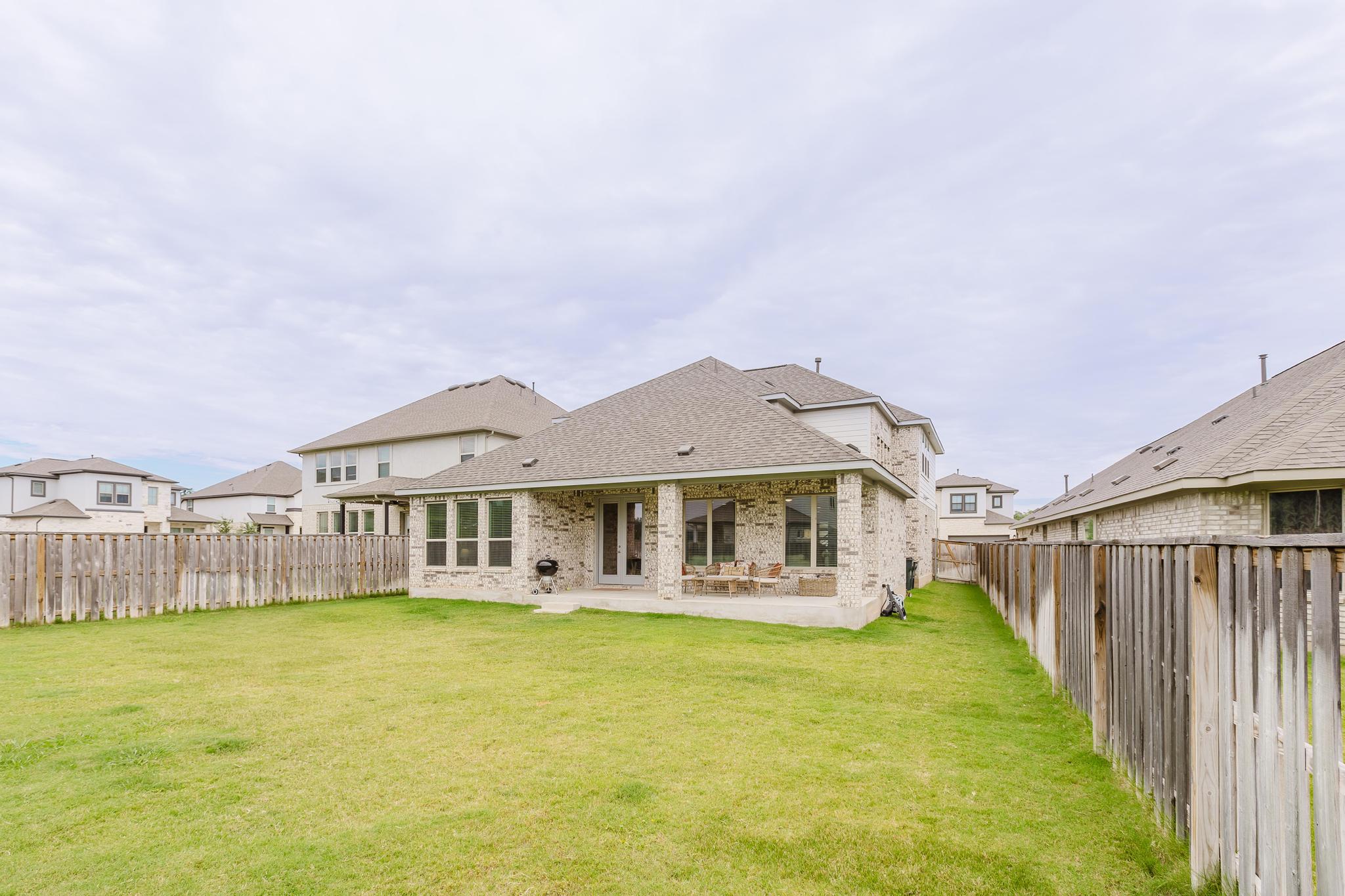 1104 Lickety Lane Georgetown, TX 78633 - Photo 35 of 40 a front view of a house with swimming pool and porch