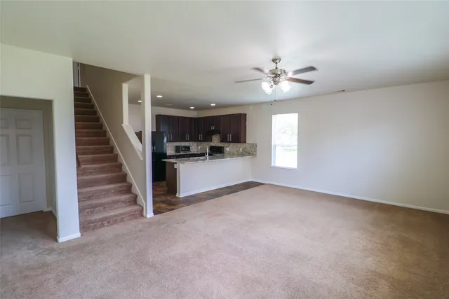 a view of a kitchen with a sink and a chandelier