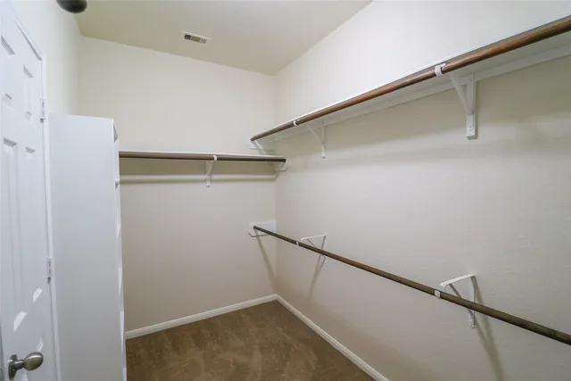 a bathroom with a tub sink and shower