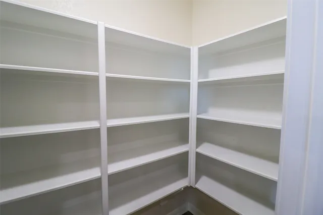 a kitchen with stainless steel appliances granite countertop a refrigerator stove and sink