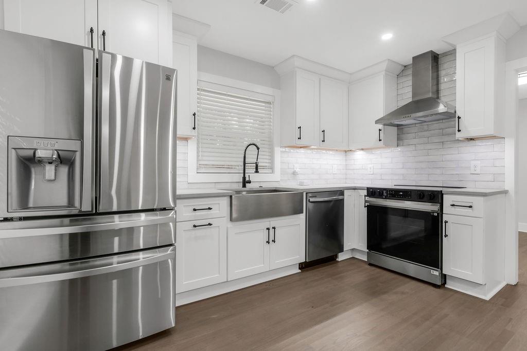 2219 Sharon Way Decatur, GA 30032 - Photo 7 of 23 a kitchen with stainless steel appliances white cabinets and a sink