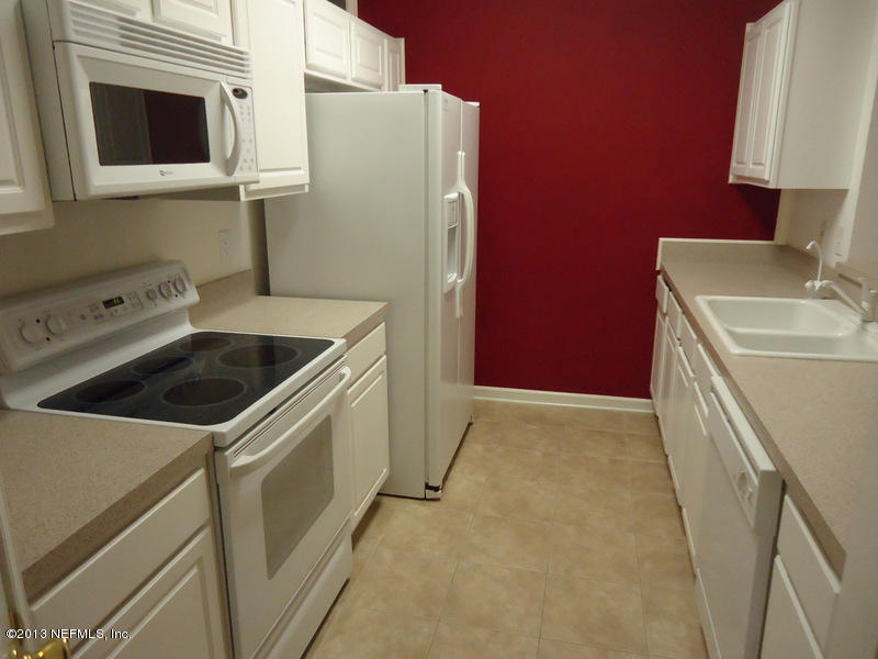 7990 Baymeadows Road East, Unit 1023 Jacksonville, FL 32256 - Photo 1 of 39 a utility room with dryer and washer