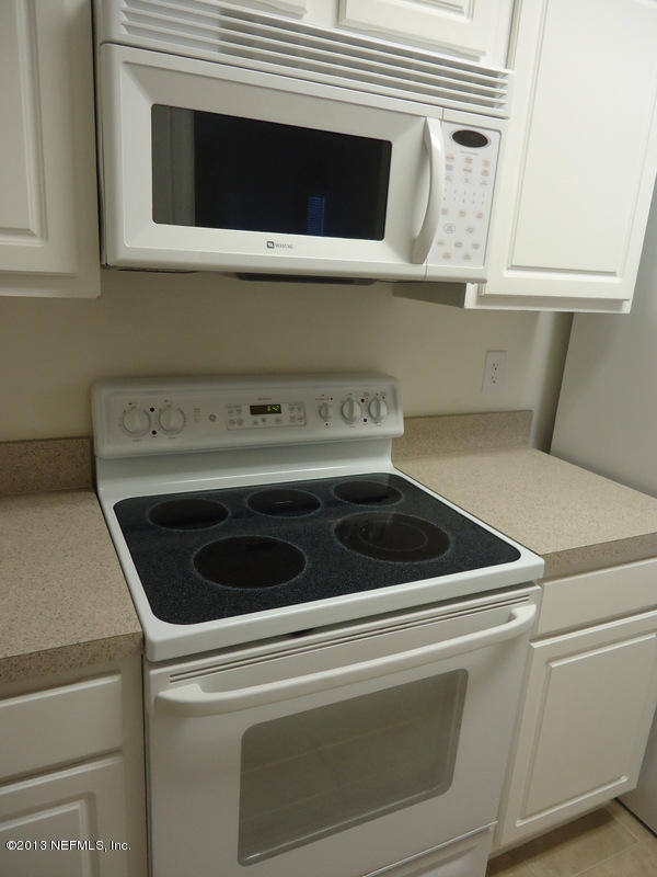7990 Baymeadows Road East, Unit 1023 Jacksonville, FL 32256 - Photo 11 of 39 a close up view of washer and dryer