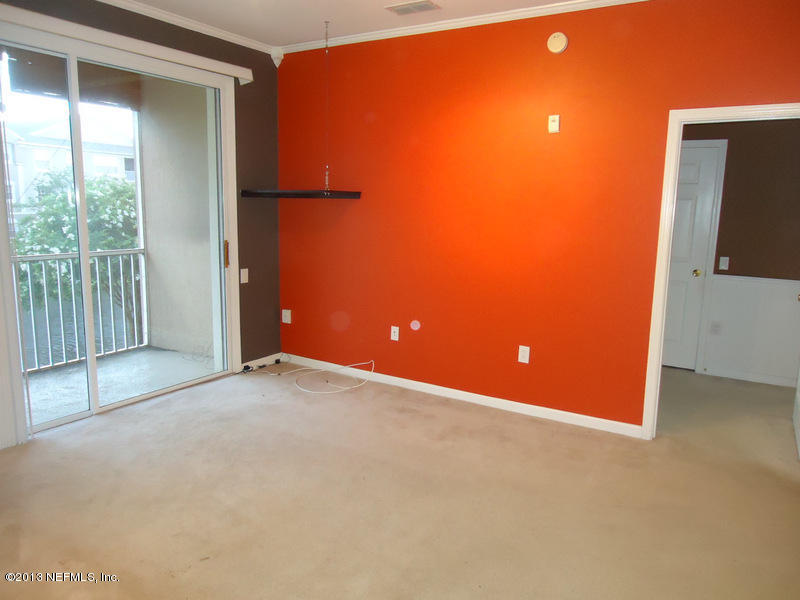 7990 Baymeadows Road East, Unit 1023 Jacksonville, FL 32256 - Photo 18 of 39 a view of an empty room with a window