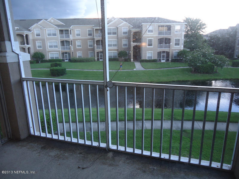 7990 Baymeadows Road East, Unit 1023 Jacksonville, FL 32256 - Photo 19 of 39 a view of a building from a yard