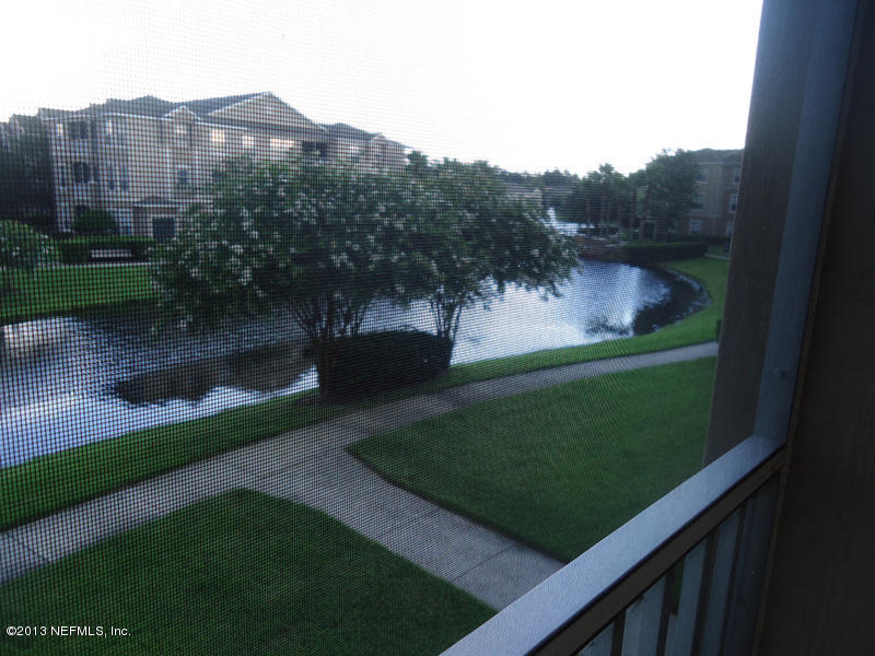 7990 Baymeadows Road East, Unit 1023 Jacksonville, FL 32256 - Photo 20 of 39 a view of a back yard of the house