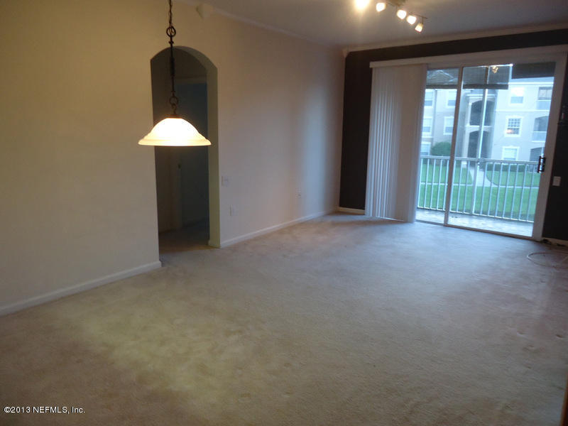 7990 Baymeadows Road East, Unit 1023 Jacksonville, FL 32256 - Photo 2 of 39 a view of an empty room with a window