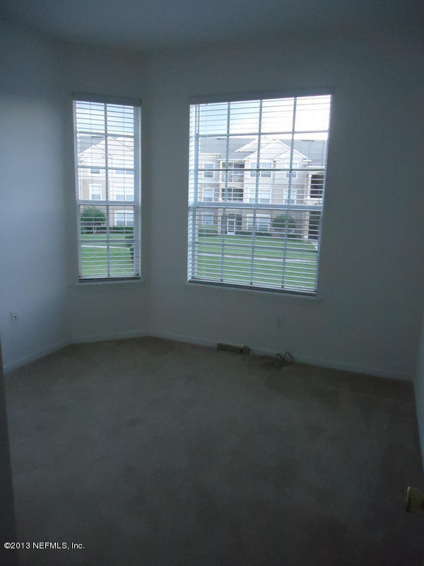 7990 Baymeadows Road East, Unit 1023 Jacksonville, FL 32256 - Photo 27 of 39 an empty room with a window