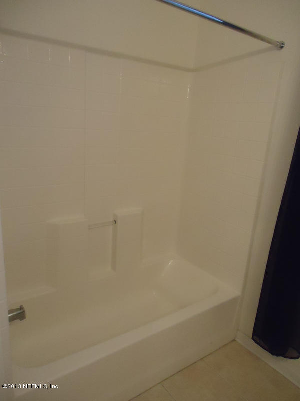 7990 Baymeadows Road East, Unit 1023 Jacksonville, FL 32256 - Photo 29 of 39 a close up of a bathtub