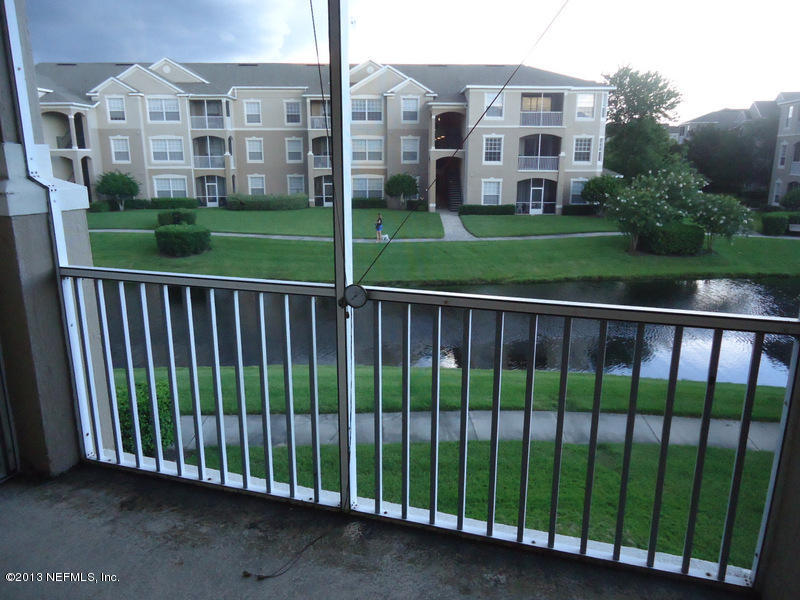 7990 Baymeadows Road East, Unit 1023 Jacksonville, FL 32256 - Photo 3 of 39 a view of a building from a yard