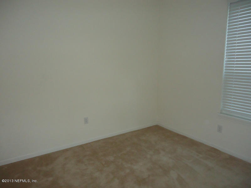 7990 Baymeadows Road East, Unit 1023 Jacksonville, FL 32256 - Photo 30 of 39 close up of a white marble wall