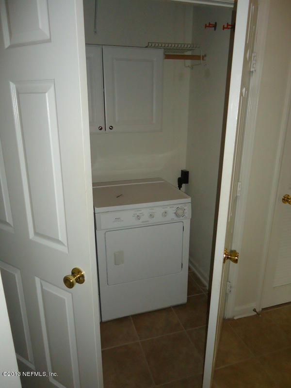 7990 Baymeadows Road East, Unit 1023 Jacksonville, FL 32256 - Photo 31 of 39 a utility room with dryer and washer