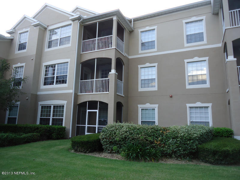 7990 Baymeadows Road East, Unit 1023 Jacksonville, FL 32256 - Photo 35 of 39 a view of a building next to a yard