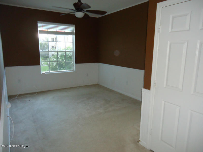 7990 Baymeadows Road East, Unit 1023 Jacksonville, FL 32256 - Photo 4 of 39 an empty room with a window