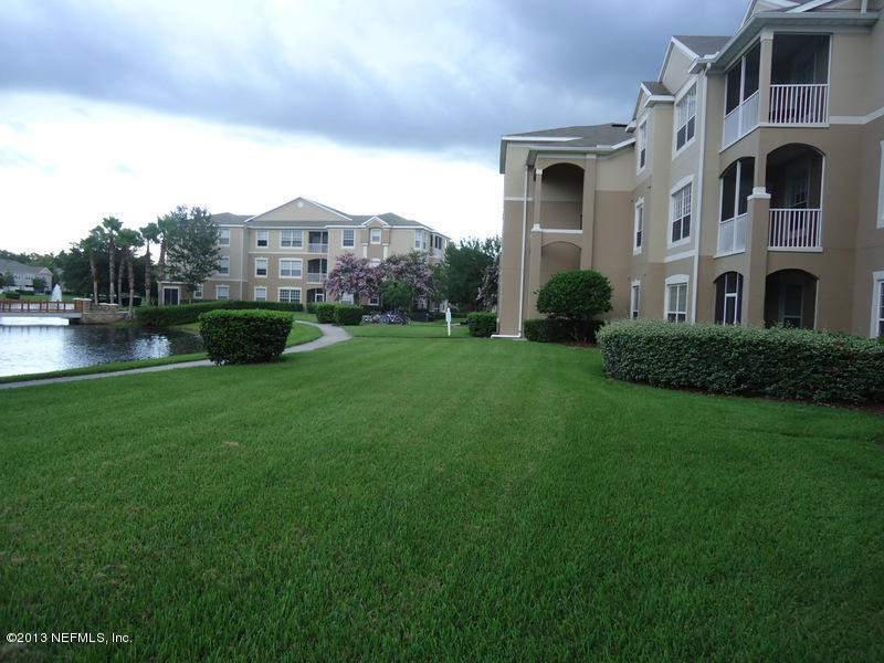 7990 Baymeadows Road East, Unit 1023 Jacksonville, FL 32256 - Photo 5 of 39 a house view with a garden space