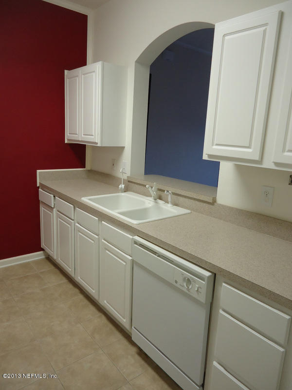 7990 Baymeadows Road East, Unit 1023 Jacksonville, FL 32256 - Photo 9 of 39 a utility room with dryer and washer