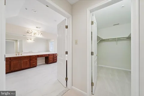 a spacious bathroom with a tub shower and sink