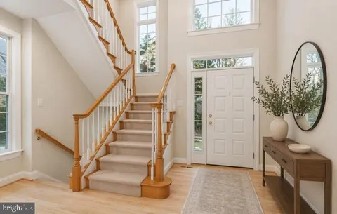 a view of an entryway with wooden floor