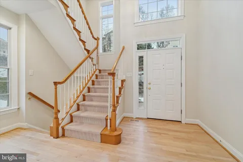 a view of entryway with wooden floor