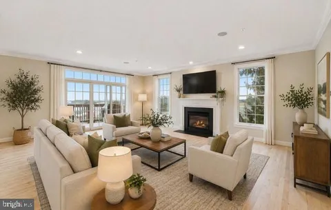 a living room with furniture fireplace and a flat screen tv