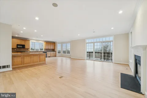 a view of kitchen with furniture and wooden floor