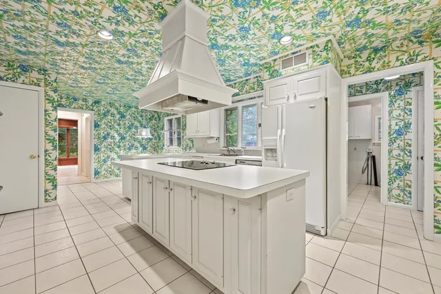 a kitchen with stainless steel appliances a sink and cabinets