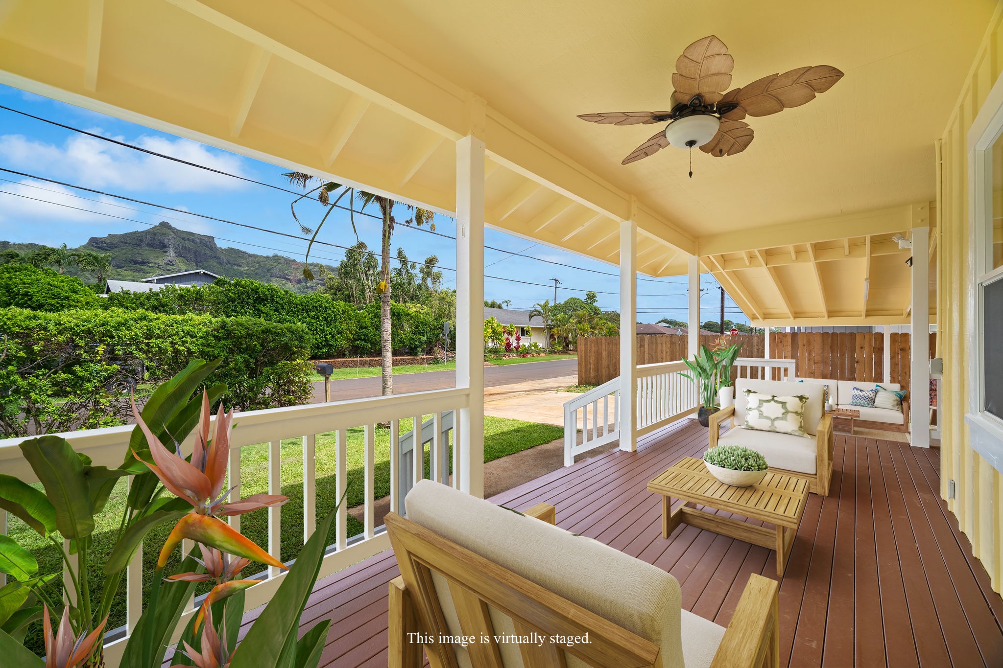 210 Eggerking Road Kapaa, HI 96746 - Photo 1 of 30 a view of a patio with couches chairs potted plants and wooden floor