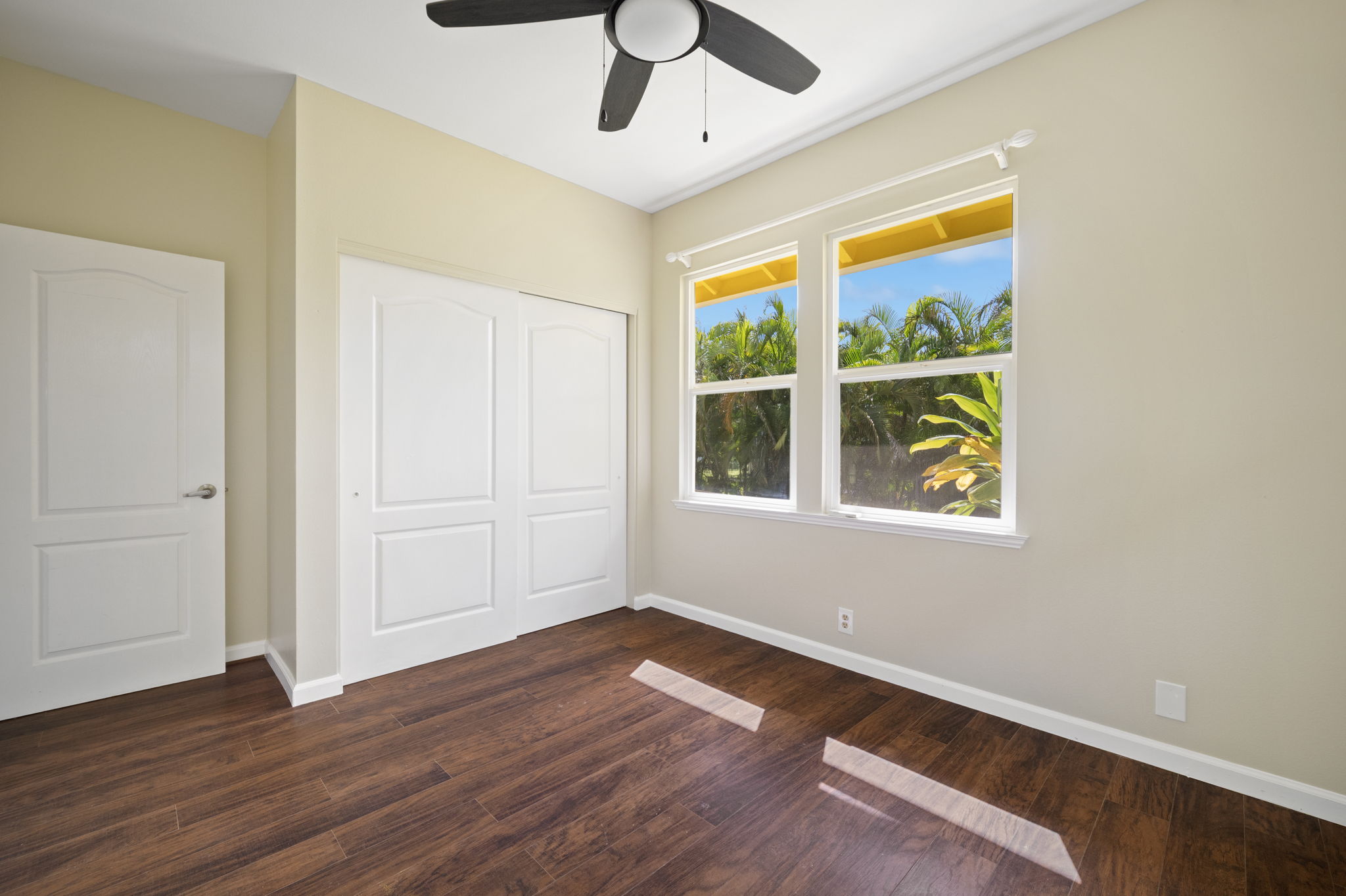 210 Eggerking Road Kapaa, HI 96746 - Photo 14 of 30 a view of empty room with wooden floor and fan
