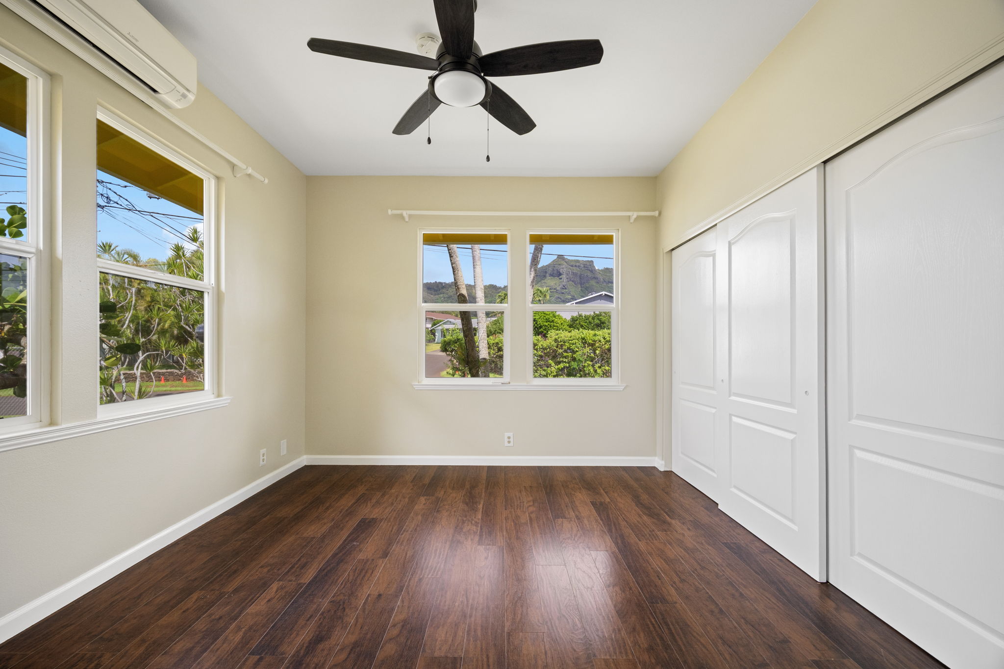 210 Eggerking Road Kapaa, HI 96746 - Photo 17 of 30 a view of empty room with wooden floor and fan