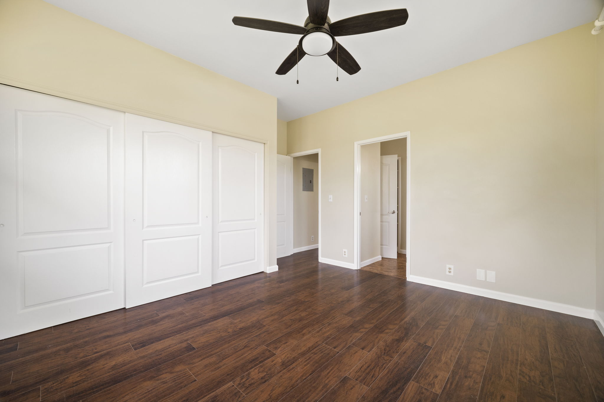 210 Eggerking Road Kapaa, HI 96746 - Photo 18 of 30 a view of room with wooden floor and ceiling fan