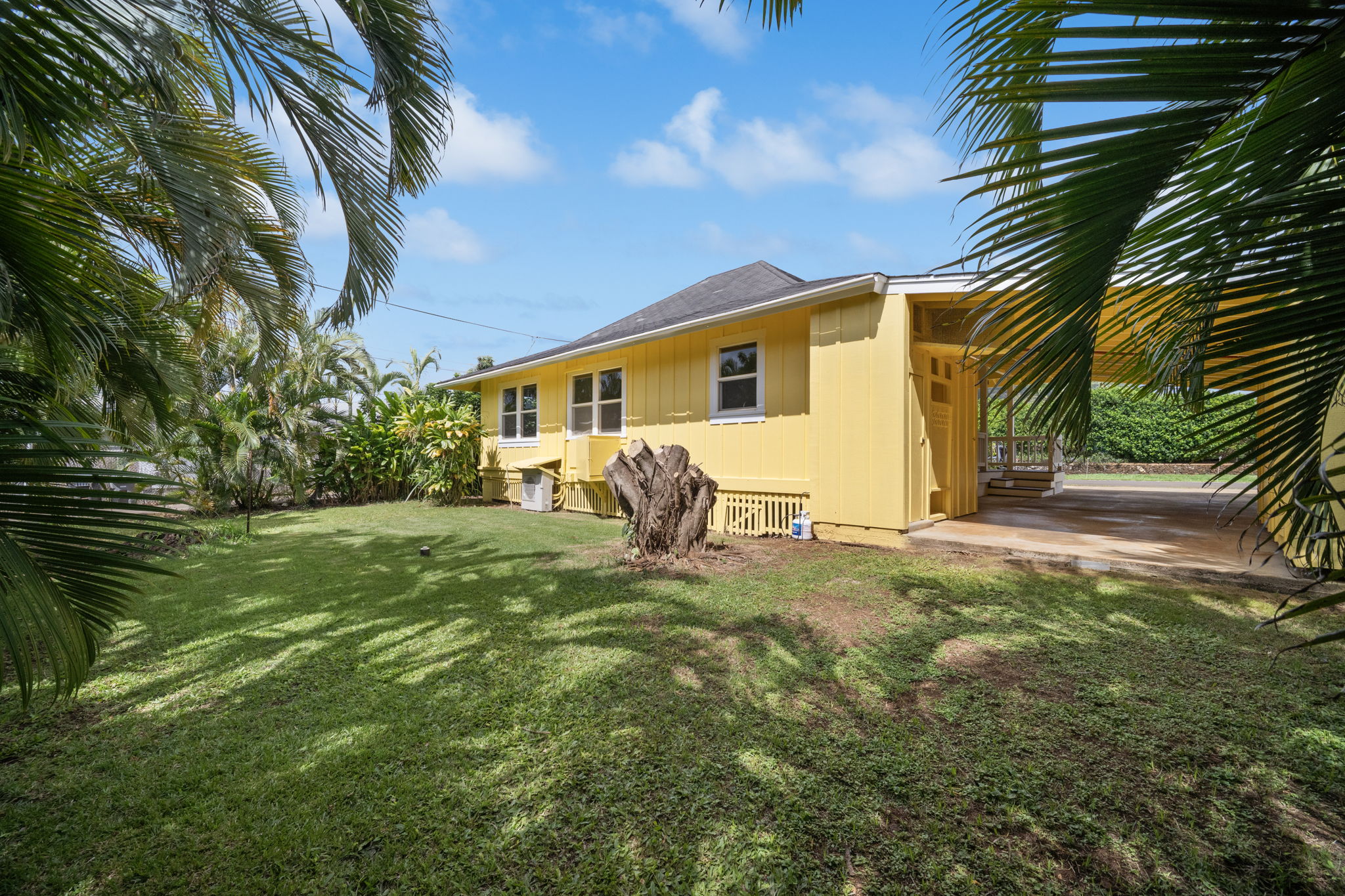 210 Eggerking Road Kapaa, HI 96746 - Photo 26 of 30 a view of a white house with yard and sitting area