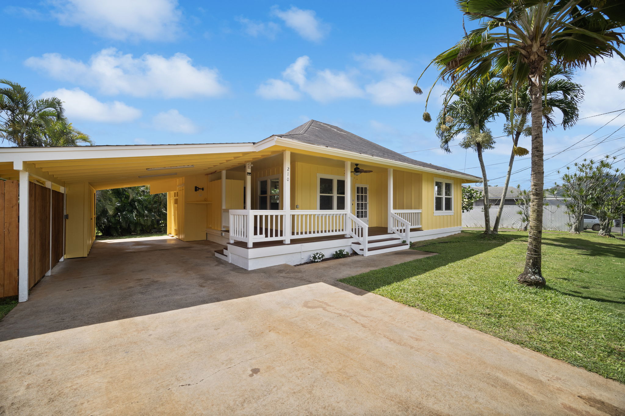 210 Eggerking Road Kapaa, HI 96746 - Photo 3 of 30 a view of a house with backyard and a tree