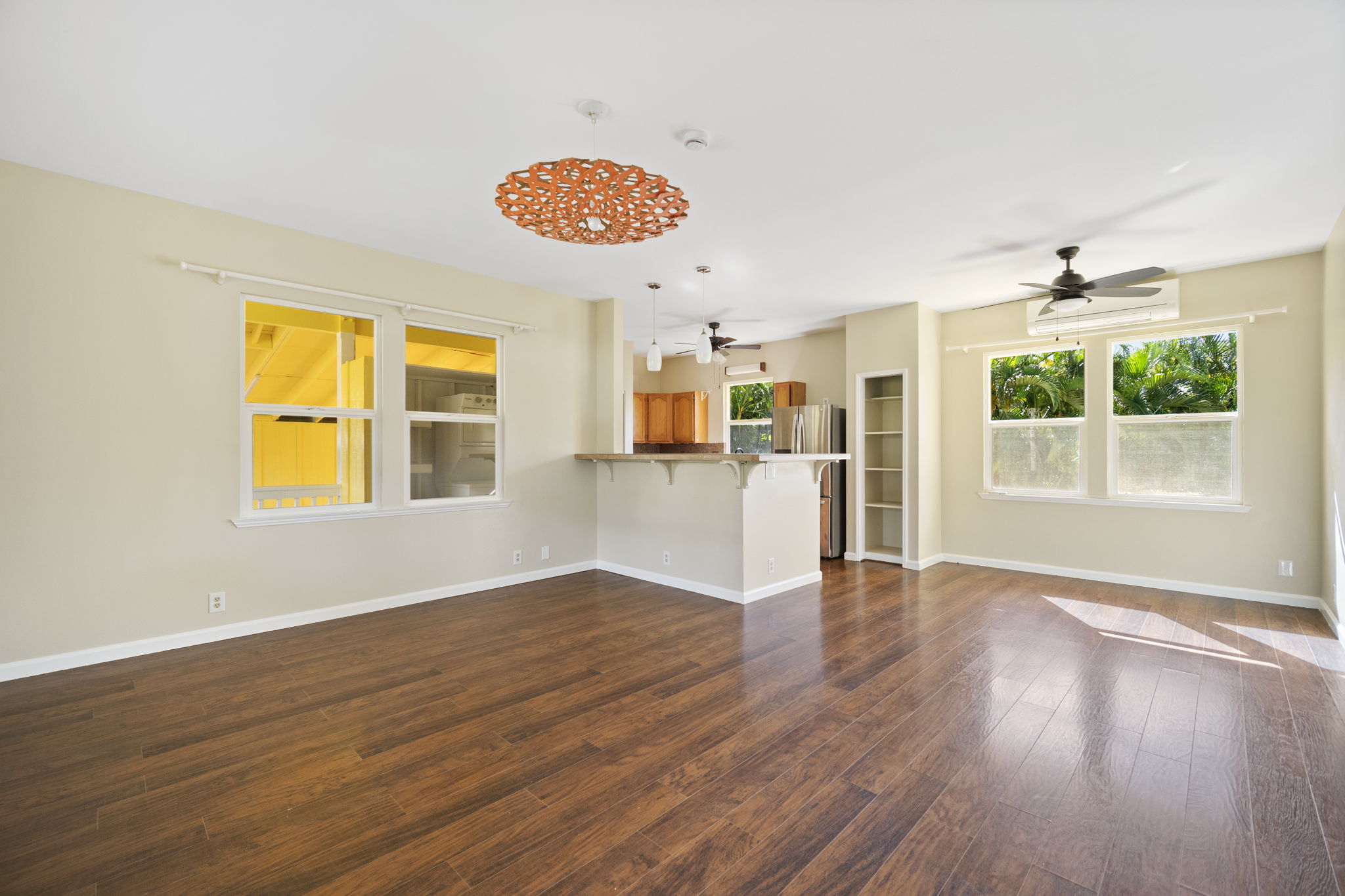 210 Eggerking Road Kapaa, HI 96746 - Photo 5 of 30 a view of an empty room with window and wooden floor